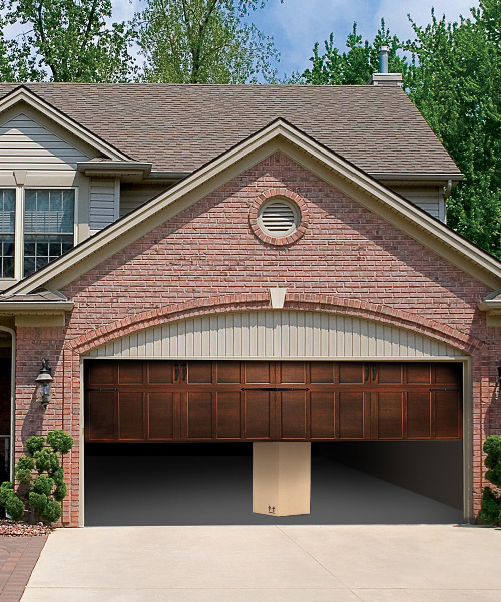 Garage door closing with a large package behind the garage door